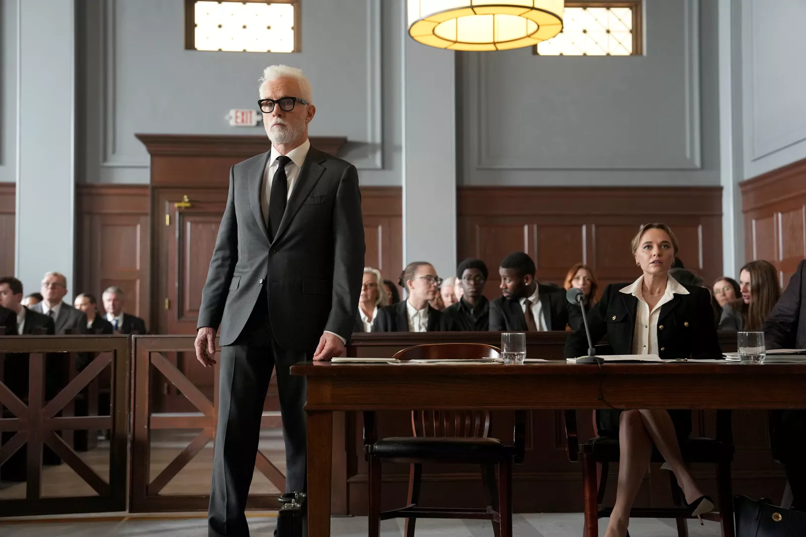 Episode 110 -- (l-r) John Slattery as Leo Drummond, Madison Iseman as Sarah Plankmore in The Rainmaker. Photo Credit: Christopher Barr/USA Network © 2025 VERSANT MEDIA. All Rights Reserved 