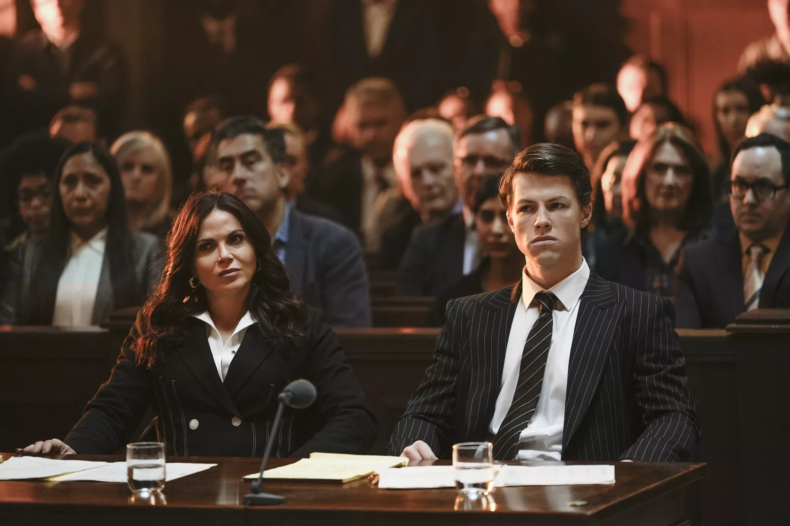 Episode 110 -- (l-r) Lana Parrilla as Jocelyn "Bruiser" Stone, Milo Callaghan as Rudy Baylor in The Rainmaker. Photo Credit: Christopher Barr/USA Network © 2025 VERSANT MEDIA. All Rights Reserved