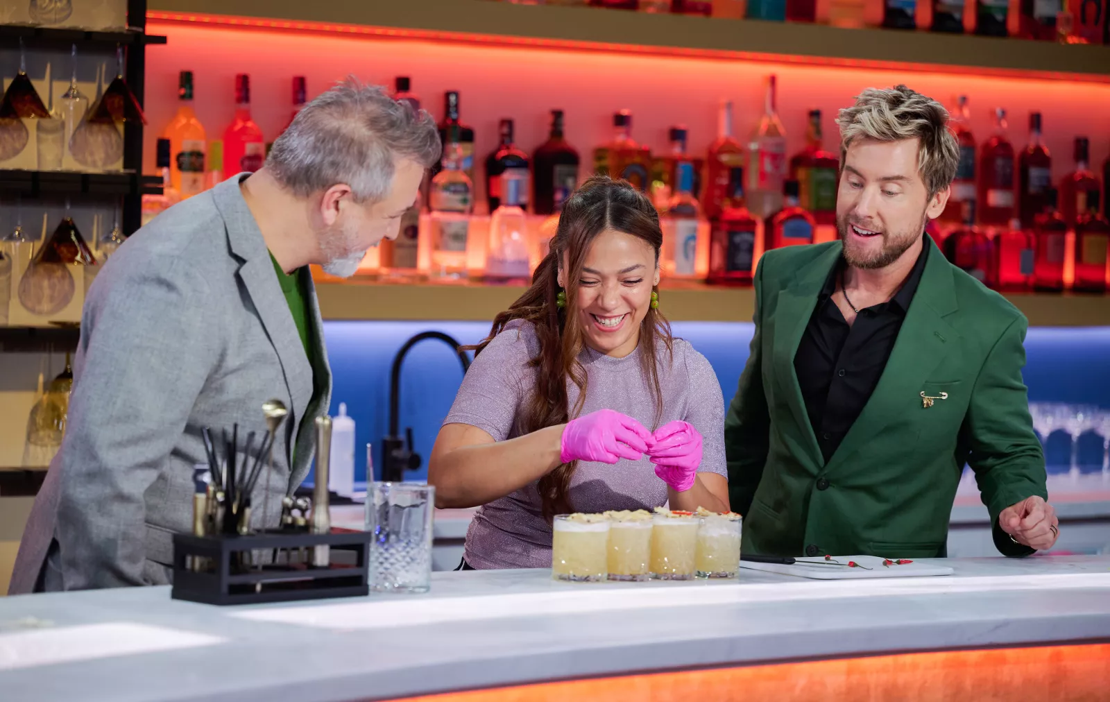 (L-R) Joey Fatone, Natasha Velasquez and Lance Bass on Cocktail Wars on E!  Photo Credit: Scott Gries/E! Entertainment © 2026 VERSANT MEDIA. All Rights Reserved.
