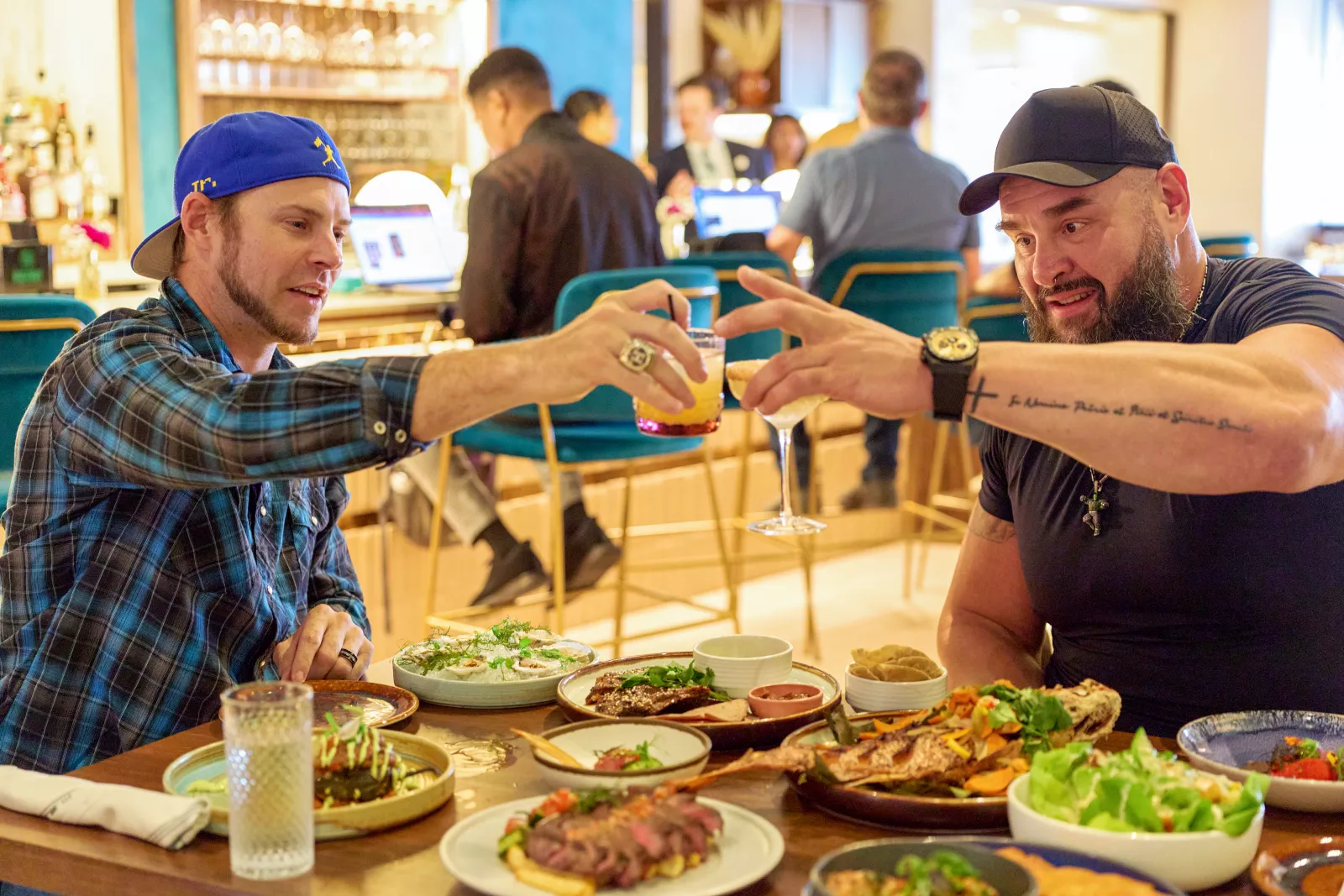 Braun Strowman and Josh Reddick visit Houston in Everything On The Menu with Braun Strowman on USA Network. Photo credit: Amy Mikler/USA Network © 2026 VERSANT MEDIA. All Rights Reserved.
