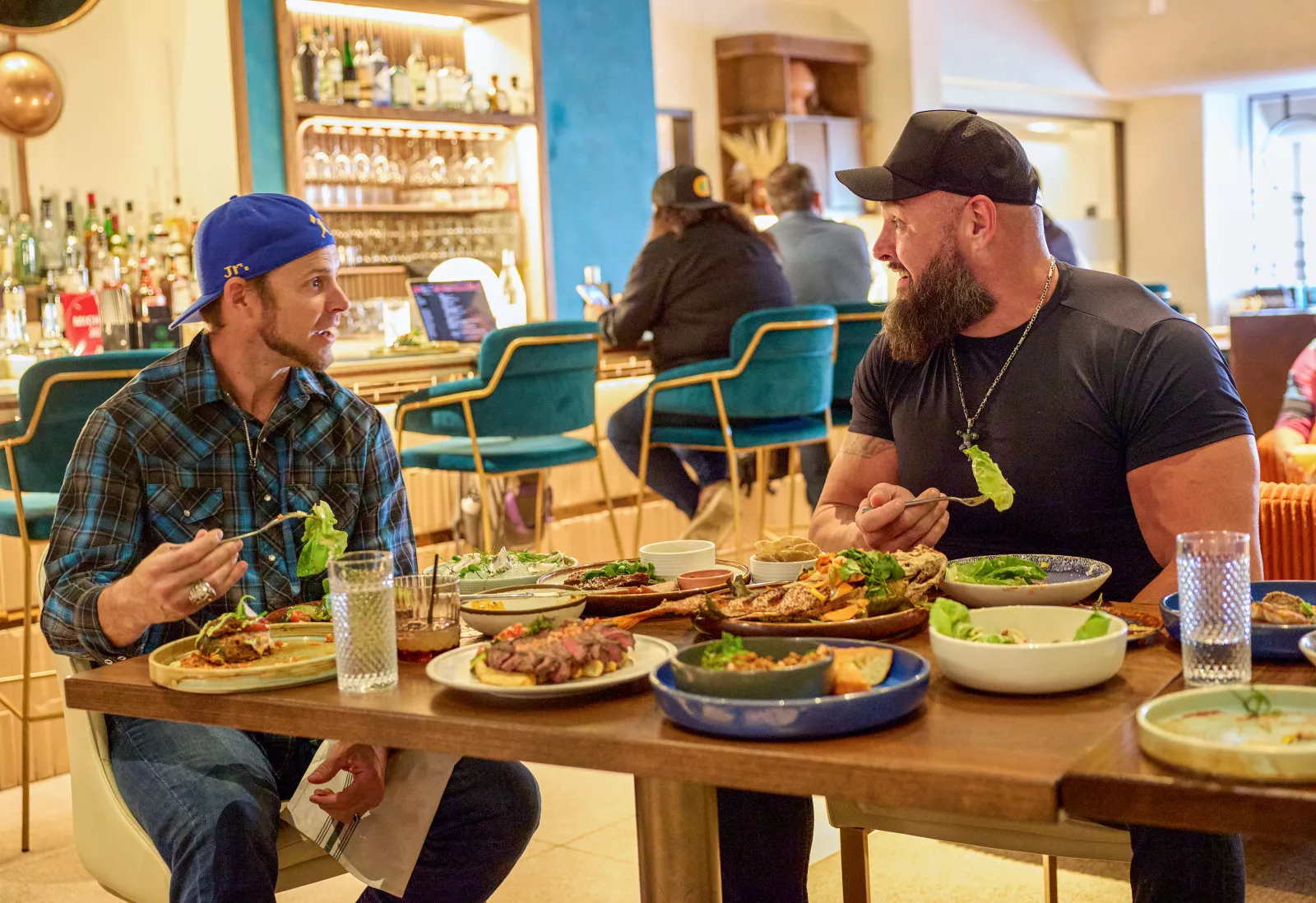 Braun Strowman and Josh Reddick visit Houston in Everything On The Menu with Braun Strowman on USA Network. Photo credit: Amy Mikler/USA Network © 2026 VERSANT MEDIA. All Rights Reserved.